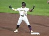 Pittsburgh Pirates' Andrew McCutchen celebrates on second base after hitting a double off Chicago Cubs pitcher Caleb Thielbar, driving in two runs, during the seventh inning of a baseball game in Pittsburgh, Sunday, April 6, 2025. (AP Photo/Gene J. Puskar)