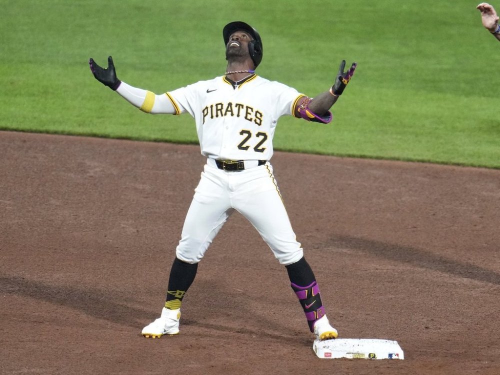 Pittsburgh Pirates' Andrew McCutchen celebrates on second base after hitting a double off Chicago Cubs pitcher Caleb Thielbar, driving in two runs, during the seventh inning of a baseball game in Pittsburgh, Sunday, April 6, 2025. (AP Photo/Gene J. Puskar)
