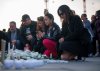 People pray during a vigil for the victims of an attack that killed 11 people at a Vancouver Lapu Lapu festival, in Ottawa, on Monday, April 28, 2025. A person drove a car into a crowd of people at the festival in Vancouver on Saturday April 26, 2025. THE CANADIAN PRESS/Chris Tanouye