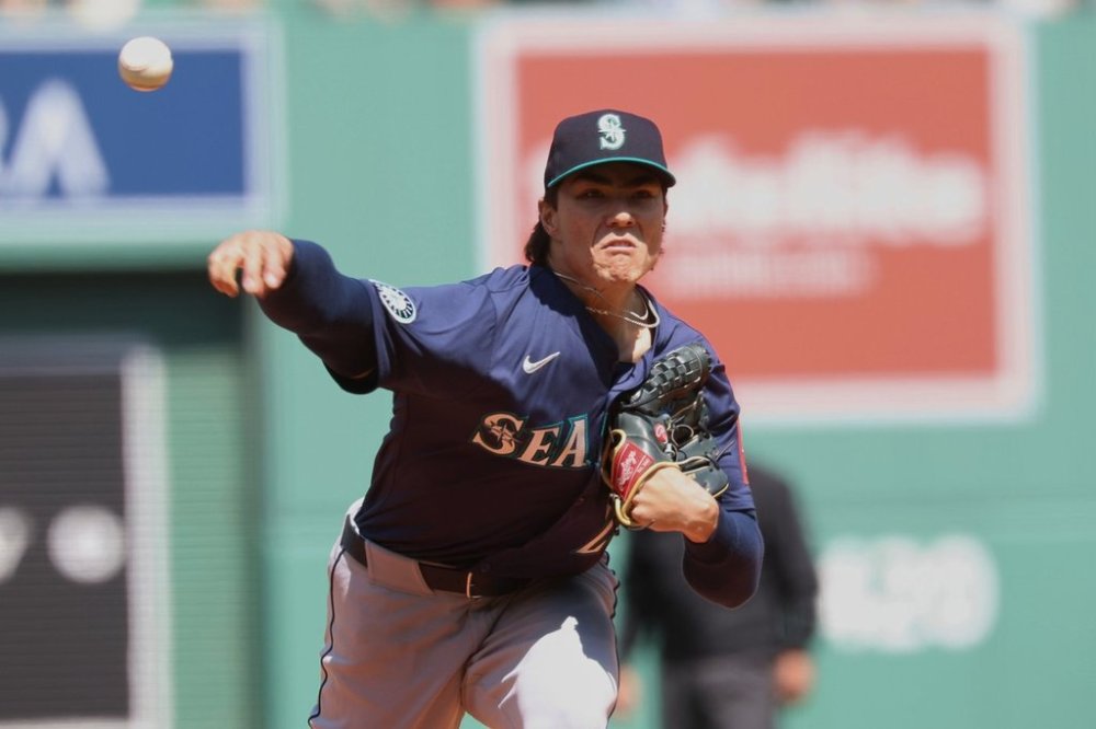 Seattle Mariners pitcher Bryan Woo throws during the first inning of a baseball game against the Boston Red Sox, Thursday, April 24, 2025, in Boston. (AP Photo/Mark Stockwell)