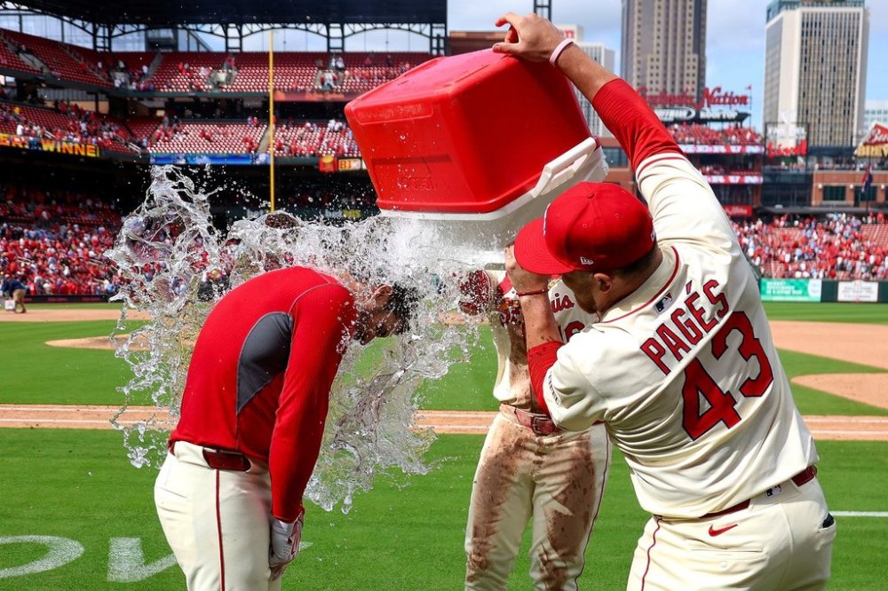 St. Louis Cardinals' Pedro Pagés (43) and Nolan Gorman dump a cooler of water on Nolan Arenado, left, in celebration of the Cardinals win against Milwaukee Brewers during a baseball game Saturday, April 26, 2025, in St. Louis. (AP Photo/Scott Kane)