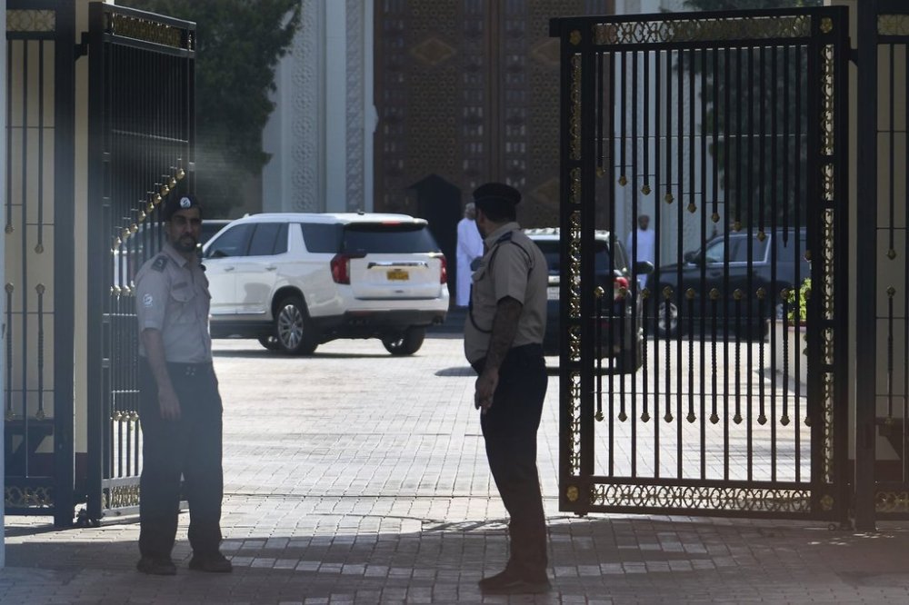 Omani security personnel watch a convoy believed to be carrying U.S. Mideast envoy Steve Witkoff in Muscat, Oman, Saturday, April 12, 2025. (AP Photo/Fatima Shbair)