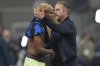 Barcelona's head coach Hansi Flick comforts Lamine Yamal after the Champions League semifinal second leg soccer match between Inter Milan and Barcelona at San Siro stadium in Milan , Italy, Tuesday, May 6, 2025. (AP Photo/Antonio Calanni)
