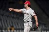 Washington Nationals pitcher Kyle Finnegan reacts after getting the final out of a baseball game against the Pittsburgh Pirates, Tuesday, April 15, 2025, in Pittsburgh. (AP Photo/Matt Freed)
