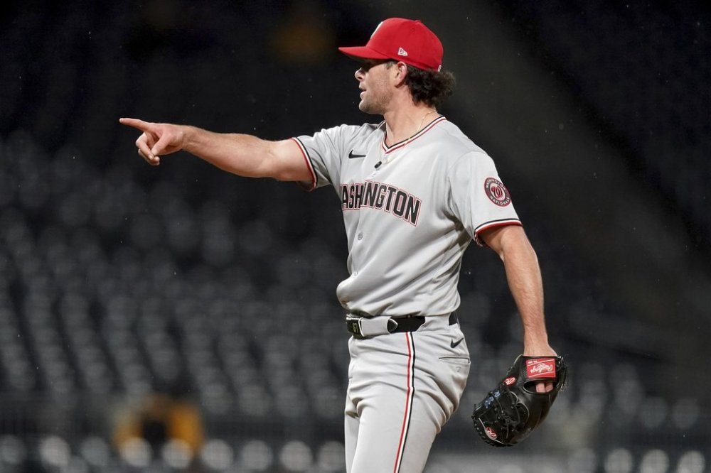 Washington Nationals pitcher Kyle Finnegan reacts after getting the final out of a baseball game against the Pittsburgh Pirates, Tuesday, April 15, 2025, in Pittsburgh. (AP Photo/Matt Freed)