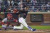 New York Mets' Juan Soto hits an RBI single during the fifth inning of a baseball game against the St. Louis Cardinals Friday, April 18, 2025, in New York. (AP Photo/Frank Franklin II)