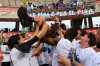 Players lift Pisa manager Filippo Inzaghi as they celebrate the promotion of soccer team Pisa to the Serie A league, after the match between Bari and Pisa of the Italian Serie B, at Stadio San Nicola, in Bari, Italy, Sunday, May 4, 2025. (Donato Fasano/LaPresse via AP)
