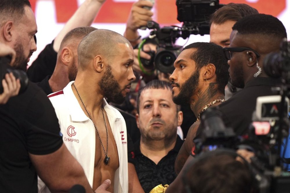 Chris Eubank Jr, left, and Conor Benn face off during the weigh in at the Business Design Centre, London, Friday April 25, 2025. (Bradley Collyer/PA via AP)