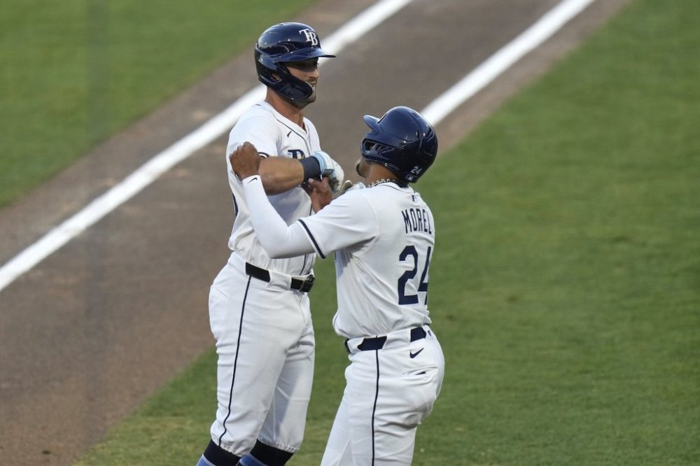 Tampa Bay Rays' Kameron Misner celebrates his two-run home run off Boston Red Sox pitcher Tanner Houck with Christopher Morel (24) during the second inning of a baseball game Monday, April 14, 2025, in Tampa, Fla. (AP Photo/Chris O'Meara)