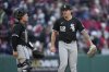 Chicago White Sox catcher Matt Thaiss, left, walks out to the mound to talk with pitcher Mike Clevinger, right, in the ninth inning of a baseball game against the Cleveland Guardians in Cleveland, Tuesday, April 8, 2025. (AP Photo/Sue Ogrocki)