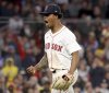 Boston Red Sox pitcher Brayan Bello reacts after striking out Seattle Mariners' Randy Arozarena leaving two runners on base during the fifth inning of a baseball game, Tuesday, April 22, 2025, in Boston. (AP Photo/Mark Stockwell)