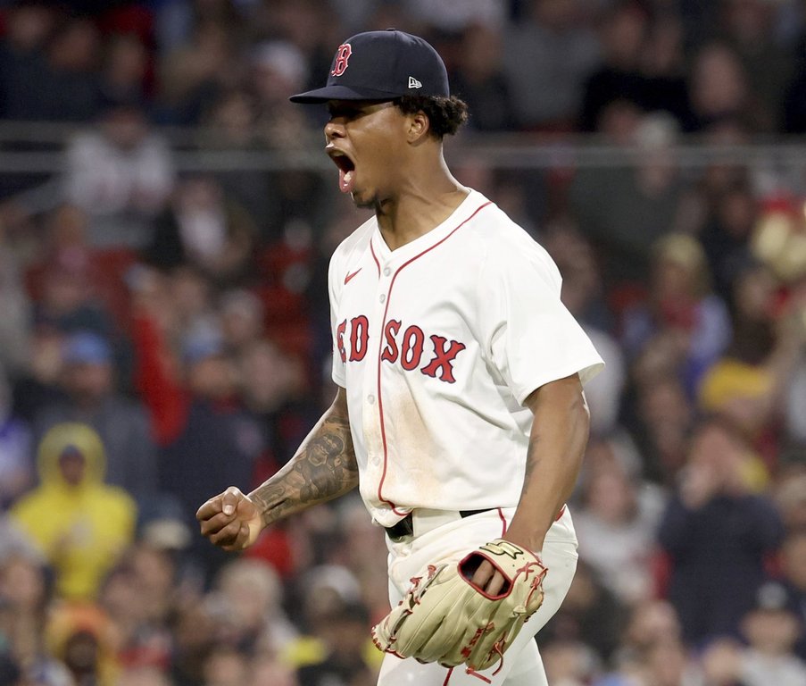 Boston Red Sox pitcher Brayan Bello reacts after striking out Seattle Mariners' Randy Arozarena leaving two runners on base during the fifth inning of a baseball game, Tuesday, April 22, 2025, in Boston. (AP Photo/Mark Stockwell)