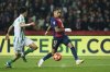Barcelona's Raphinha, right, dribbles the ball past Betis' Marc Bertra during a Spanish La Liga soccer match between Barcelona and Real Betis at the Lluis Companys Olympic stadium in Barcelona, Spain, Saturday, April 5, 2025. (AP Photo/Joan Monfort)