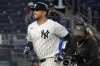 New York Yankees' J.C. Escarra, left, reacts after hitting a home run during the eighth inning of the second baseball game of a doubleheader against the Toronto Blue Jays, Sunday, April 27, 2025, in New York. (AP Photo/Pamela Smith)