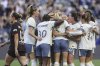 Seattle Reign players celebrate a goal by forward Maddie Dahlien in the first half of an NWSL soccer game against Portland Thorns FC in Seattle, Friday, April 18, 2025. (Kevin Clark/The Seattle Times via AP)