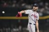 Atlanta Braves starting pitcher Chris Sale reaches out for a new ball during the second inning of a baseball game against the Arizona Diamondbacks Friday, April 25, 2025, in Phoenix. (AP Photo/Ross D. Franklin)