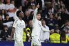 Real Madrid's Federico Valverde celebrates scoring his side's first goal next to Vinicius Junior during the Spanish La Liga soccer match between Real Madrid and Athletic Bilbao at the Santiago Bernabeu stadium in Madrid, Sunday, April 20, 2025. (AP Photo/Manu Fernandez)