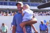 Scottie Scheffler, front left, holds his son Bennett after winning the CJ Cup Byron Nelson golf tournament in McKinney, Texas, Sunday, May 4, 2025. (AP Photo/LM Otero)