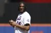 St. John's men's basketball player Zuby Ejiofor gets set to throw out a ceremonial first pitch before a baseball game between the New York Mets and the Miami Marlins, Wednesday, April 9, 2025, in New York. (AP Photo/Pamela Smith)