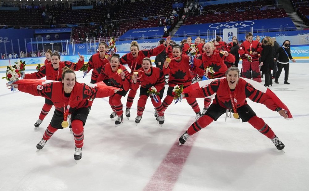 Team Canada celebrates with their gold medals after defeating the United States in women's hockey gold medal game action at the 2022 Winter Olympics in Beijing on Thursday, Feb. 17, 2022. THE CANADIAN PRESS/Ryan Remiorz