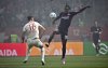 Augsburg's Cedric Zesiger, left, and Frankfurt's Michy Batshuayi challenge for the ball during the between FC Augsburg and Eintracht Frankfurt at the WWK Arena in Augsburg, Germany, Sunday, April 20, 2025. (Jan-Philipp Strobel/dpa via AP)