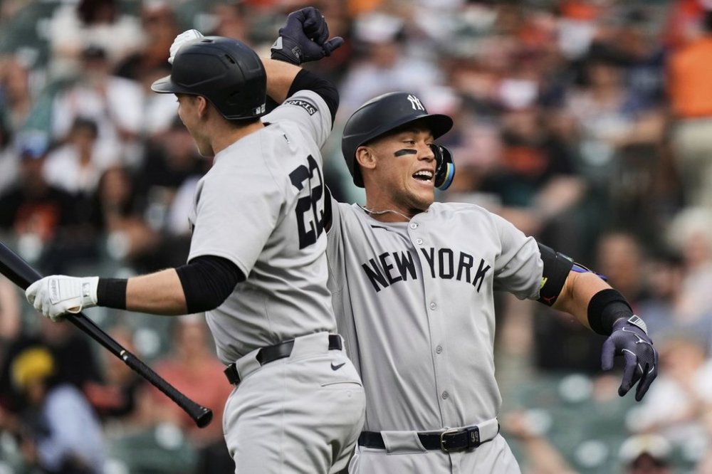 New York Yankees' Aaron Judge, left, celebrates with Ben Rice (22) after hitting a home run during the first inning of a baseball game against the Baltimore Orioles, Tuesday, April 29, 2025, in Baltimore. (AP Photo/Stephanie Scarbrough)