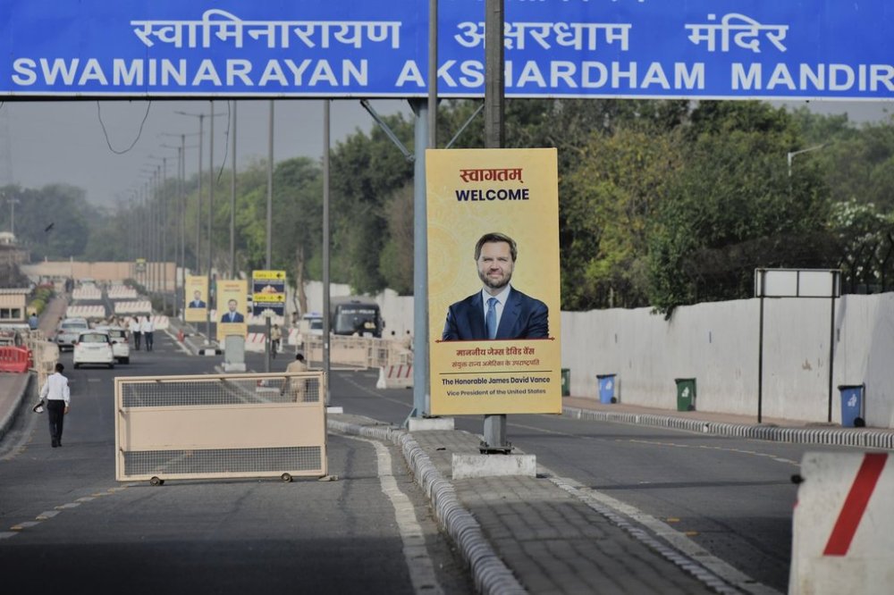 A banner welcoming U.S. Vice President JD Vance is tied to an electric pole on a street in New Delhi, India, Monday, April 21, 2025. (AP Photo)
