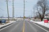 Federal election campaign signs for Conservative Party of Canada candidate Pierre Poilievre and Liberal Party of Canada candidate for Carleton Bruce Fanjoy stand opposite each other on a rural road in the Ottawa community of Stittsville on Thursday, April 10, 2025. THE CANADIAN PRESS/Spencer Colby