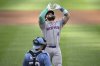 New York Mets' Francisco Alvarez, top, celebrates after his two-run home run in front of Washington Nationals catcher Keibert Ruiz, bottom, during the second inning of a baseball game, Saturday, April 26, 2025, in Washington. (AP Photo/Nick Wass)