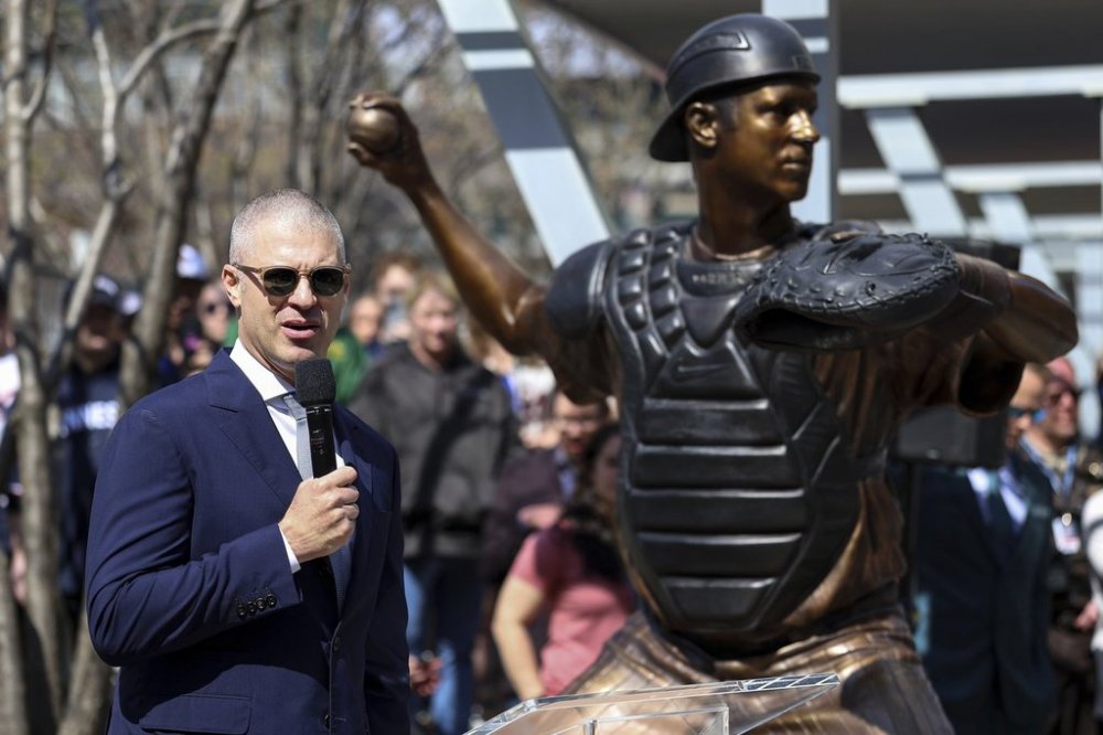 Former Minnesota Twins player Joe Mauer speaks after his statue was unveiled before a baseball game between the Minnesota Twins and the Detroit Tigers Sunday, April 13, 2025, in Minneapolis. (AP Photo/Matt Krohn)
