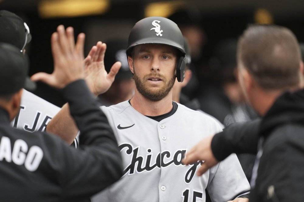 Chicago White Sox's Austin Slater (15) celebrates after scoring against the Detroit Tigers in the ninth inning during a baseball game, Friday, April 4, 2025, in Detroit. (AP Photo/Paul Sancya)