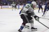 Dallas Stars center Matt Duchene, front, drives past Colorado Avalanche defenseman Sam Malinski in the second period of Game 3 of an NHL hockey first-round playoff series Wednesday, April 23, 2025, in Denver. (AP Photo/David Zalubowski)
