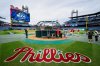 FILE - Philadelphia Phillies gather around the batting cage during a baseball workout, Friday, Oct. 4, 2024, in Philadelphia, ahead of the National League Division Series against the New York Mets. (AP Photo/Chris Szagola, File)