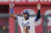 Kansas City Royals' Salvador Perez celebrates on second after hitting a two-run double during the fifth inning of the second baseball game of a doubleheader against the Colorado Rockies, Thursday, April 24, 2025, in Kansas City, Mo. (AP Photo/Charlie Riedel)