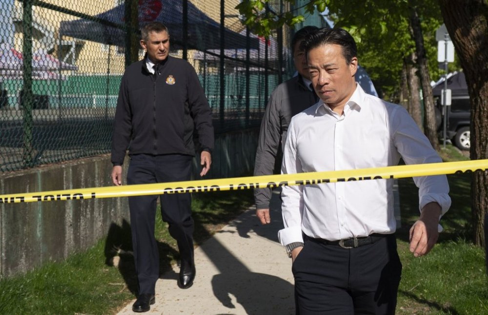 Vancouver Mayor Ken Sim (right) and Vancouver police acting Chief Steve Rai leave after visiting the scene Sunday where a vehicle drove into a crowd at a street festival on Saturday evening in Vancouver. THE CANADIAN PRESS/Rich Lam