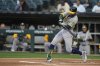 Athletics' Tyler Soderstrom (21) hits a three-run home run during the first inning of a baseball game against the Chicago White Sox, Tuesday, April 15, 2025, in Chicago. (AP Photo/Erin Hooley)