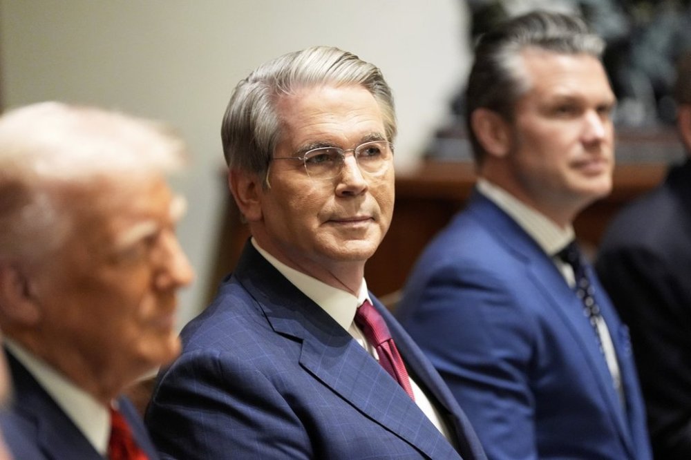 Treasury Secretary Scott Bessent and Defense Secretary Pete Hegseth listen as President Donald Trump speaks before a luncheon with Italy's Prime Minister Giorgia Meloni in the Cabinet Room of the White House, Thursday, April 17, 2025, in Washington. (AP Photo/Alex Brandon)