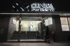 People relax outside the Olivos Clinic, where soccer star Diego Maradona got surgery weeks before his 2020 passing, in Buenos Aires, Tuesday, May 6, 2025. (AP Photo/Rodrigo Abd)