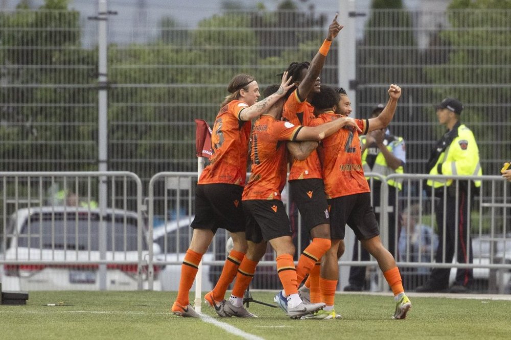 Forge FC players celebrate a goal against Toronto FC during first half Canadian Championship semifinal action in Hamilton, Ont., on Wednesday, July 10, 2024. Defending champion Forge FC and Atletico Ottawa face off in Hamilton on Saturday to see who advances to the Nov. 9 Canadian Premier League championship game against Calvary FC. THE CANADIAN PRESS/Nick Iwanyshyn