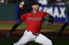 Cleveland Guardians starting pitcher Tanner Bibee delivers during the first inning of a baseball game against the New York Yankees Tuesday, April 22, 2025, in Cleveland. (AP Photo/David Dermer)