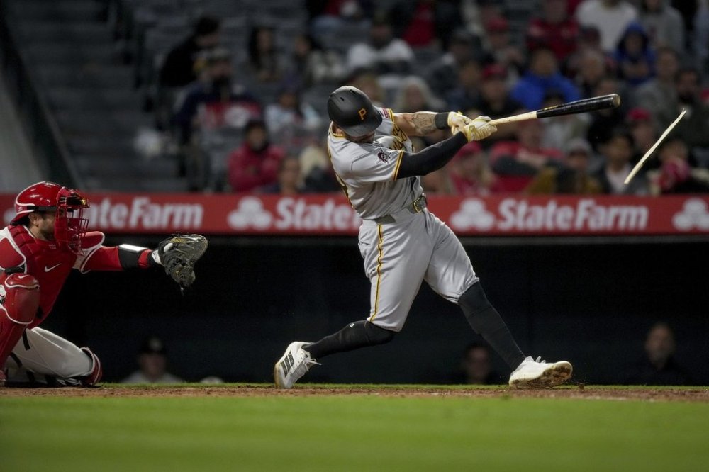 Pittsburgh Pirates Tommy Pham's bat breaks as he singles during the ninth inning of a baseball game against the Los Angeles Angels Wednesday, April 23, 2025, in Anaheim, Calif. (AP Photo/Eric Thayer)