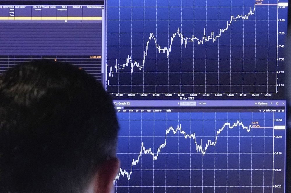 A trader works on the floor of the New York Stock Exchange, Tuesday, April 22, 2025. (AP Photo/Richard Drew)