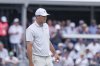 Scottie Scheffler stands on the 16th green during the first round of the CJ Cup Byron Nelson golf tournament in McKinney, Texas, Thursday, May 1, 2025. (AP Photo/Gareth Patterson)