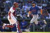 New York Mets' Brandon Nimmo (9) scores on a sacrifice fly hit by Jeff McNeil off Washington Nationals pitcher Trevor Williams (not shown) during the second inning of a baseball game in Washington, Monday, April 28, 2025. (AP Photo/Terrance Williams)