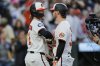 Baltimore Orioles' Ryan O'Hearn, center right, celebrates with Gunnar Henderson (2) after hitting a three-run home run during the third inning of a baseball game against the New York Yankees, Monday, April 28, 2025, in Baltimore. (AP Photo/Stephanie Scarbrough)
