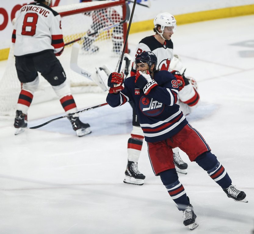 Winnipeg Jets' Alex Iafallo (9) celebrates his goal against the New Jersey Devils during first period NHL action in Winnipeg on Friday, March 28, 2025. THE CANADIAN PRESS/John Woods