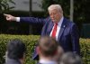 President Donald Trump gestures to the crowd as he departs after welcoming the 2025 College Football National Champions, the Ohio State University football team, during an event on the South Lawn of the White House, Monday, April 14, 2025, in Washington. (AP Photo/Manuel Balce Ceneta)