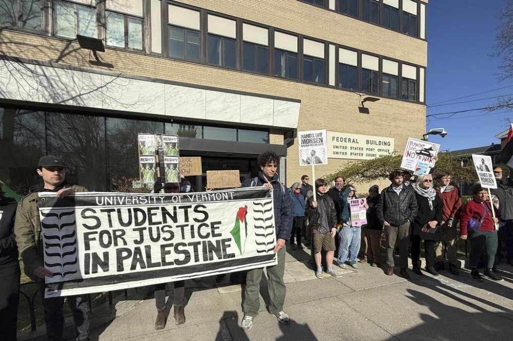 Protesters gather outside federal court ahead of a hearing for Mohsen Mahdawi, a Palestinian man arrested at a Vermont immigration office during an interview about finalizing his U.S. citizenship and a legal permanent resident who led protests against the war in Gaza at Columbia University, Wednesday, April 23, 2025 in Burlington, Vt. (AP Photo/Amanda Swinhart)