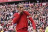 Liverpool's Virgil van Dijk celebrates after scoring his side's second goal during the English Premier League soccer match between Liverpool and West Ham United at Anfield in Liverpool, Sunday, April 13, 2025. (AP Photo/Ian Hodgson)