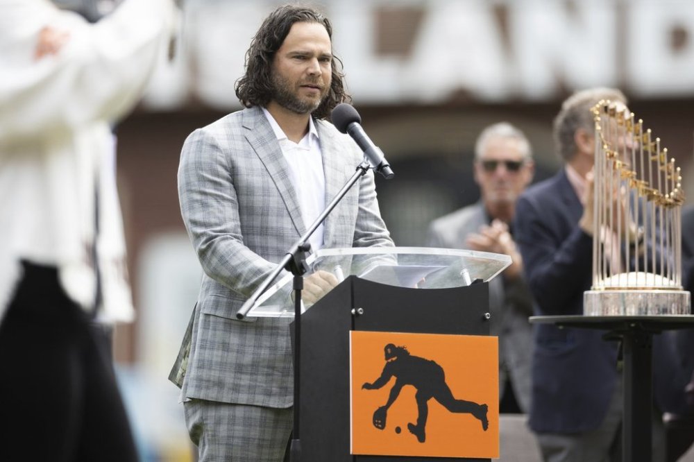 Former San Francisco Giants shortstop Brandon Crawford gets acknowledged before a baseball game between the San Francisco Giants and Texas Rangers Saturday, April 26, 2025, in San Francisco. (AP Photo/Benjamin Fanjoy)